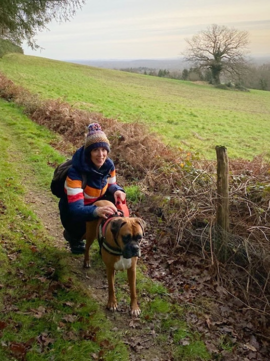 Libi, a previous winner, smiling next to Ruby, her rescue dog. 