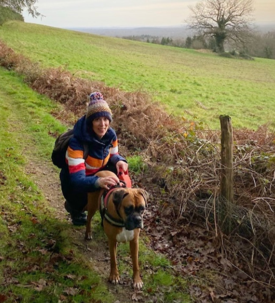 Libi, a previous winner, smiling next to Ruby, her rescue dog. 
