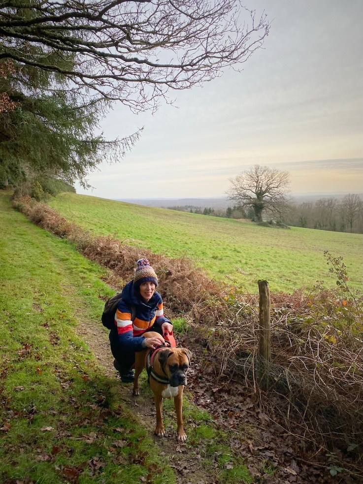 Libi, a previous winner, smiling next to Ruby, her rescue dog. 