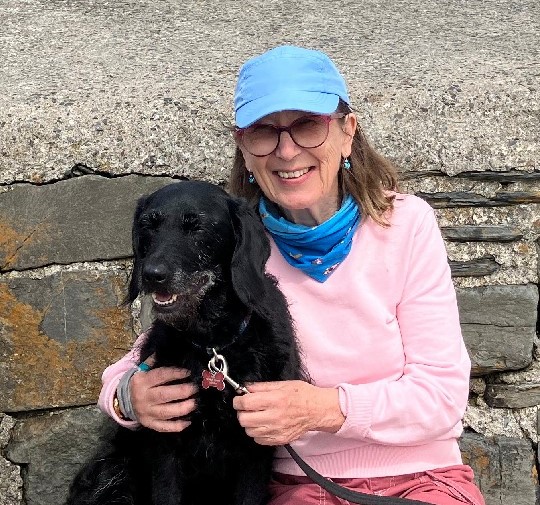 Susan Logan, a Compassion in World Farming raffle prize winner, with her dog.